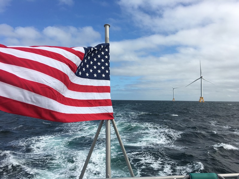 US flag by ocean