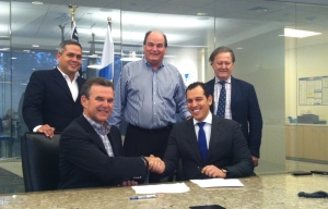 The team signs the documents at Intermarine’s Houston office.