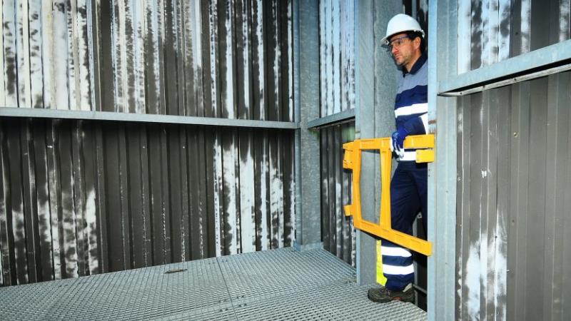 man operating safety gate